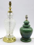 A glass column table lamp with metal mounts H39cm and a green glazed pottery lamp H28cm