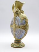 Rare Mettlach glazed nautilus ewer with a figure emerging from the shell and with applied strap