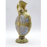 Rare Mettlach glazed nautilus ewer with a figure emerging from the shell and with applied strap