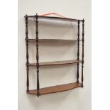 Victorian mahogany three hight high serpentine wall shelf, having brass mounts and turned supports,