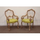 Pair of 19th century beech French style arm chairs, floral carved cresting rail, scrolled arms,