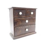 Small Victorian stained pine chest fitted with two short and two long drawers with ceramic handles