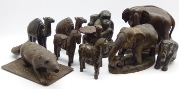 Two Eastern carved elephants, carved ape, birds,