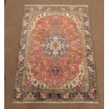 Persian Tabriz ground rug, blue medallion and floral geometric design on pink field,