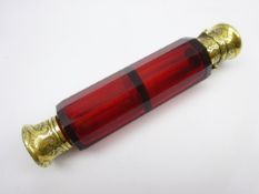 Victorian ruby glass double ended scent flask of panel sided design with engraved gilt metal mounts
