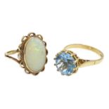 Gold oval opal ring and a blue stone set ring,