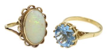 Gold oval opal ring and a blue stone set ring,