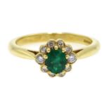 18ct gold oval emerald and diamond cluster ring,
