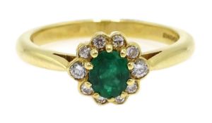 18ct gold oval emerald and diamond cluster ring,