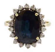 Gold oval sapphire and diamond cluster ring,