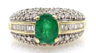 Gold oval emerald ring, with baguette and round brilliant cut diamond shoulders, stamped 14K,