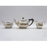 Silver 3 piece tea set of oblong form with gadrooned border,