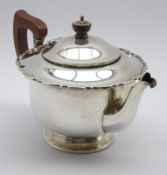 Silver circular teapot with crimped rim,