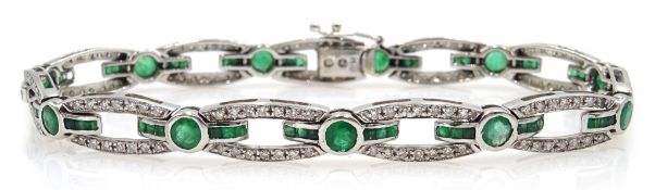 White gold round and calibre cut emerald and round brilliant cut diamond link bracelet,