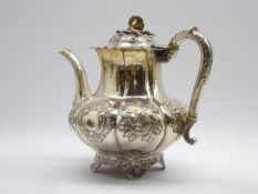 William IV silver teapot with embossed floral decoration,