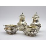 Pair of silver oblong salts with half body reeded decoration and a pair of matching pepperettes