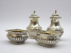 Pair of silver oblong salts with half body reeded decoration and a pair of matching pepperettes