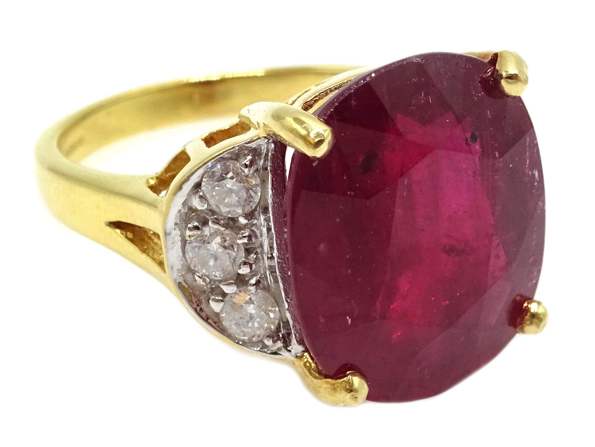 18ct gold oval ruby ring, with three diamonds set each side, hallmarked, ruby approx 10.