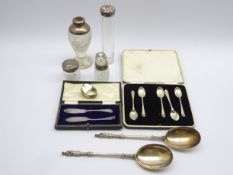 Small engraved silver oval box, 4 silver mounted glass dressing table jars, 5 teaspoons,