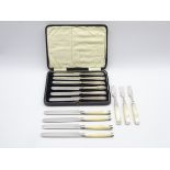 Set of six silver handled tea knives, cased,