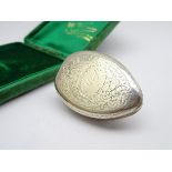 Silver vinaigrette of ovoid shape with engraved border,