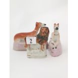 Pair Victorian Staffordshire Whippets on pillow bases with small lion and lamb group