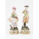 Pair Mid C19th German Figures elaborately costumed gent with companion (some faults)