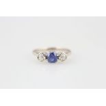 18ct White Gold Three Stone Sapphire & Diamond Ring central cushion cut light blue sapphire with two