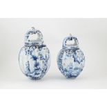 Graduated Pair C19th European Delft Water Vessels fluted ovoid bodies with mask spouts,