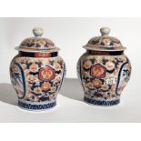 Pair C19th Imari Vase and Covers ovoid body painted with florals in the traditional manner 25cm