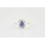 18ct 11stone Sapphire & Diamond Cluster Ring central oval mixed cut medium blue sapphire with