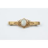 NZ 9ct Single Opal Bar Brooch central oval milk opal with fancy scroll framing marked H & N, Harry &