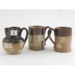 Small Doulton Lambeth Ale Jug with two mugs, traditional decorations
