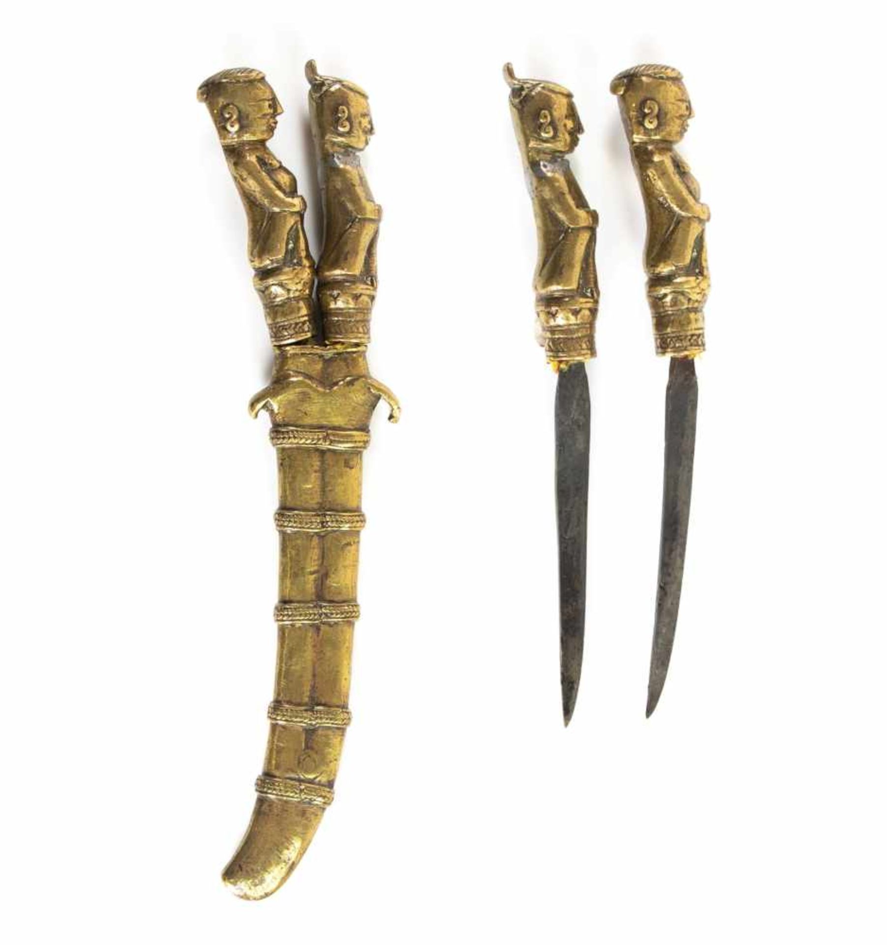 Two small brass knives in brass scabbard with, Sumatra 19th century.Two small brass knives in