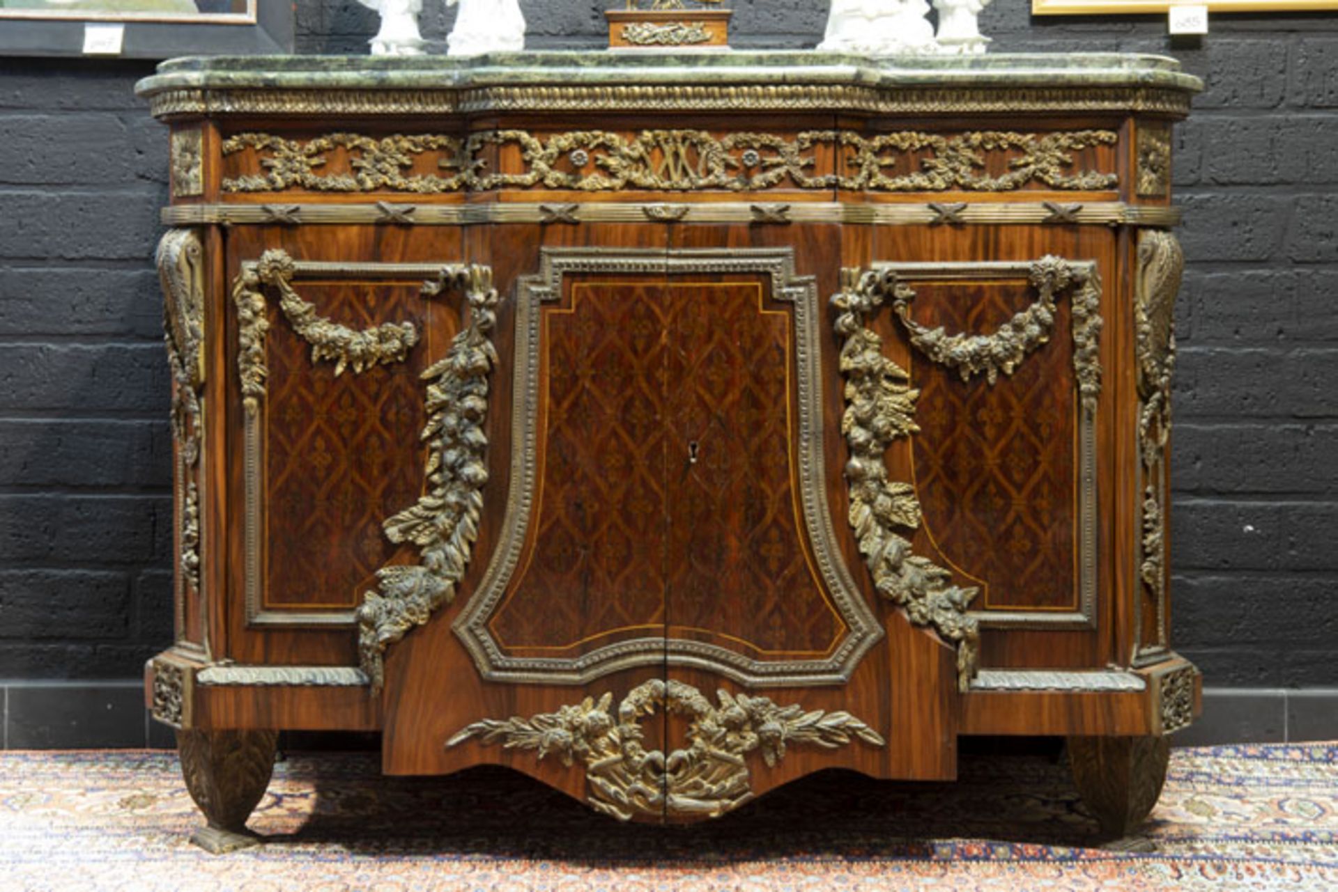 old neoclassical chest of drawers in parquetry with rich mountings in guilded bronze [...]