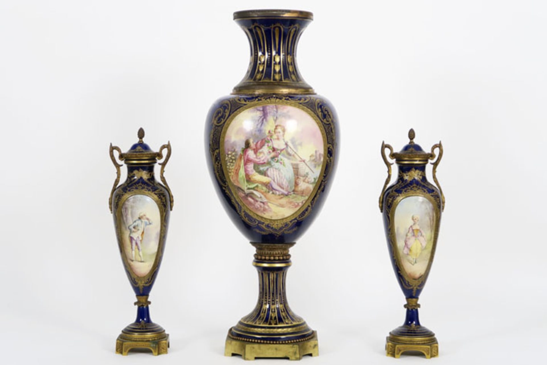one pair of lidded and one larger antique vase in Sèvres porcelain and bronze - - [...]