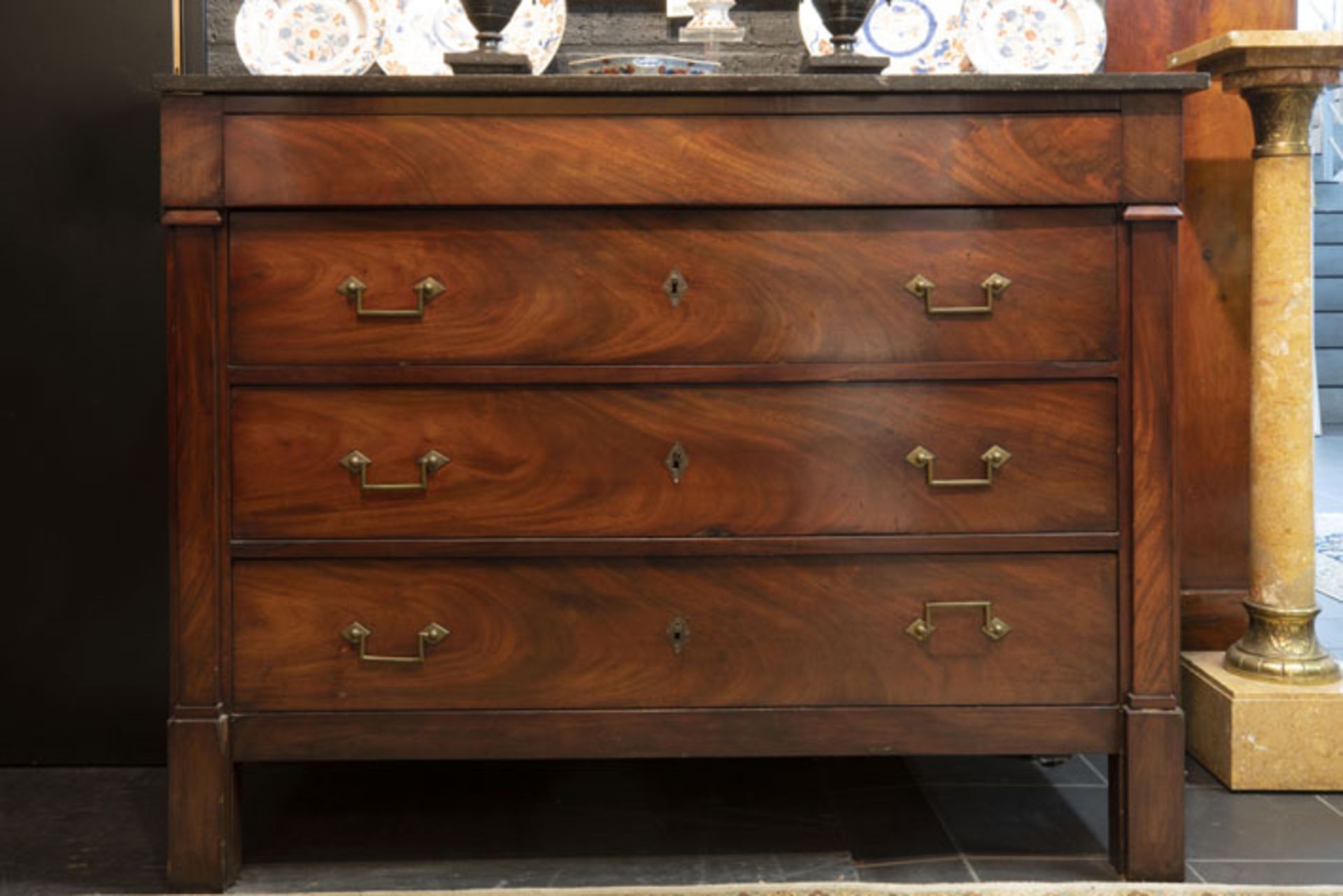 early 19th Cent. neoclassical chest of drawers mahogany with a marble top - - [...]