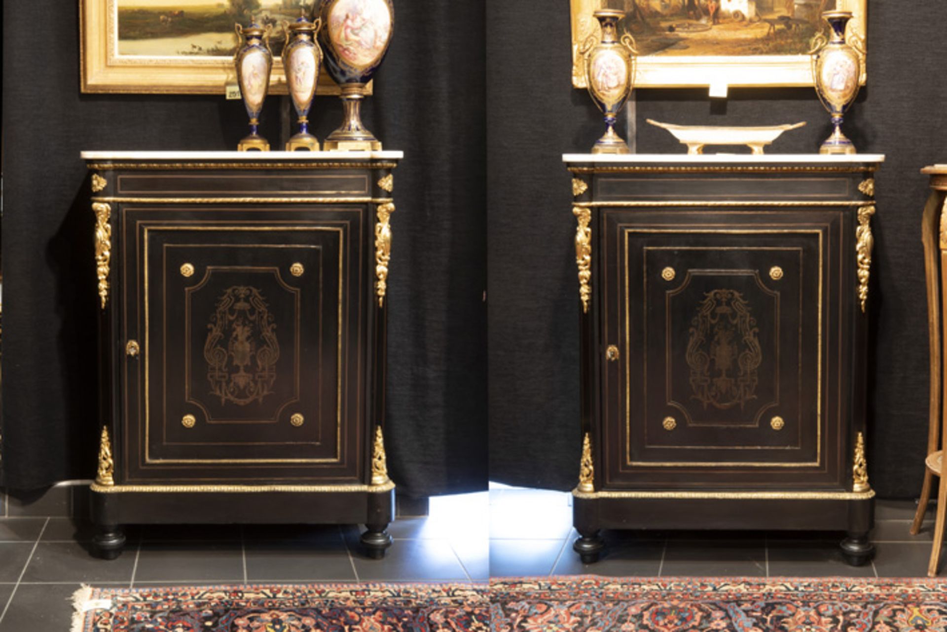 19th Cent. French pair of Napoleon III cabinets in "Boulle" with mountings in guilded [...]