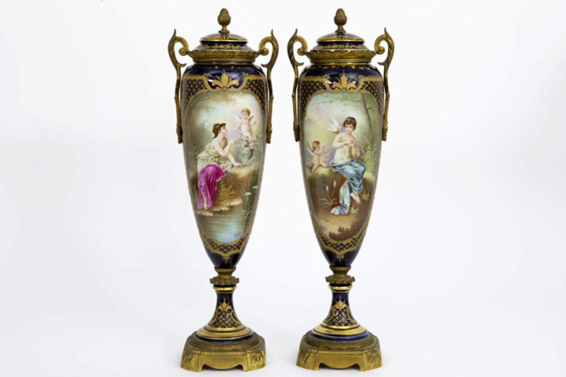 pair of lidded vases in Sèvres porcelain with bronze mountings and with painting [...]