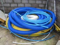 Quantity of assorted flexible and rigid plastic piping, including gas 40mm, water, etc.. Located The