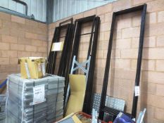 Approx twenty five steel racking/storage uprights and pallet of associated shelves