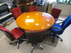 Dark wood circular table, approx dia 1800mm and six various cloth upholstered chairs