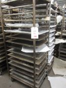 Four steel framed 15-shelf mobile bakers rack trolleys and assortment of trays