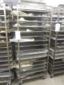 Four steel framed 15-shelf mobile bakers rack trolleys and assortment of trays