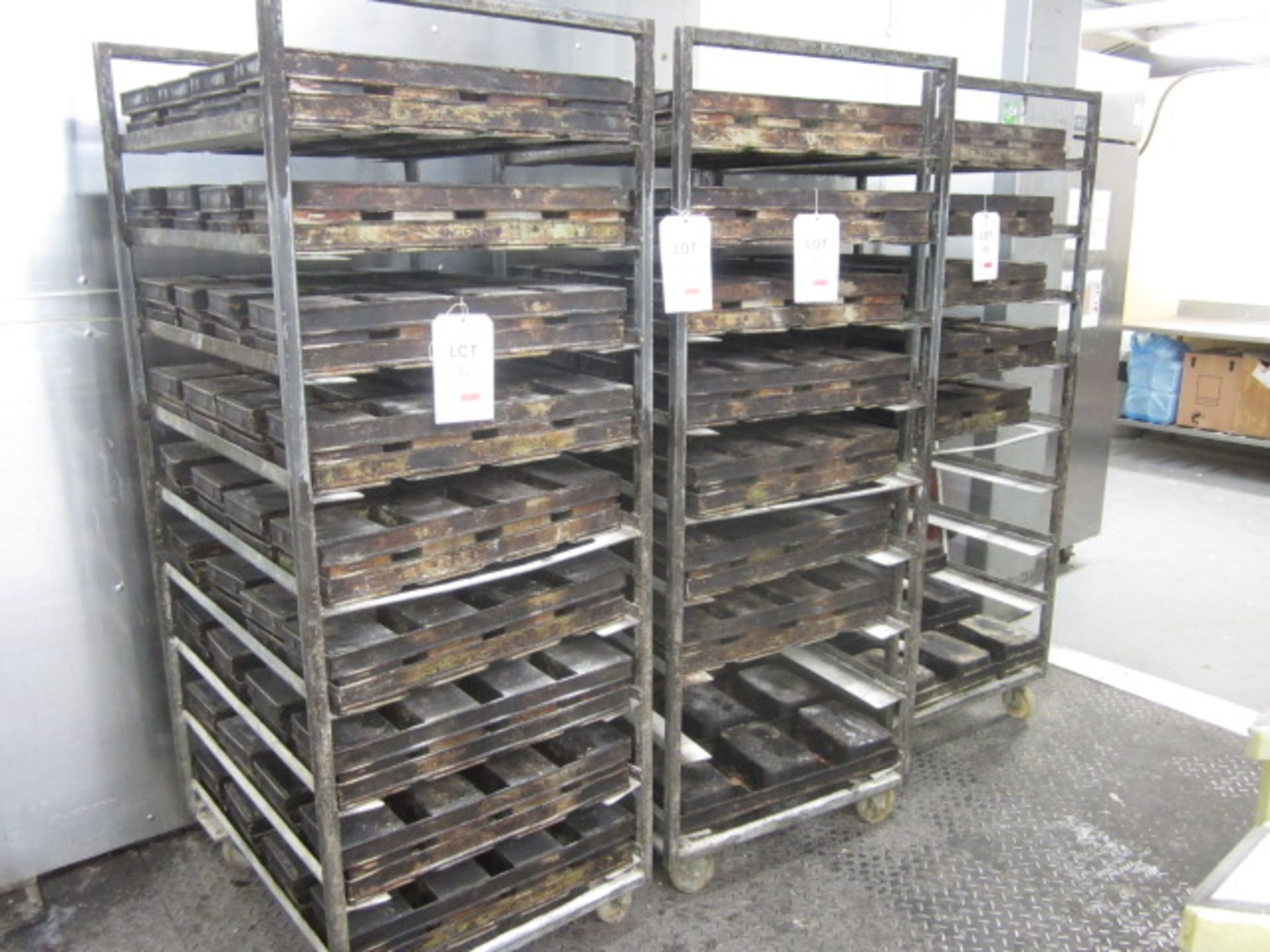 Three Galvanised steel 9-shelf mobile bakers tray racks (excluding contents)