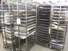 Four steel framed 15-shelf mobile bakers rack trolleys and assortment of trays