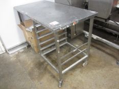 Stainless steel mobile food preparation work surface with undercounter shelving rack. approx. 1200 x