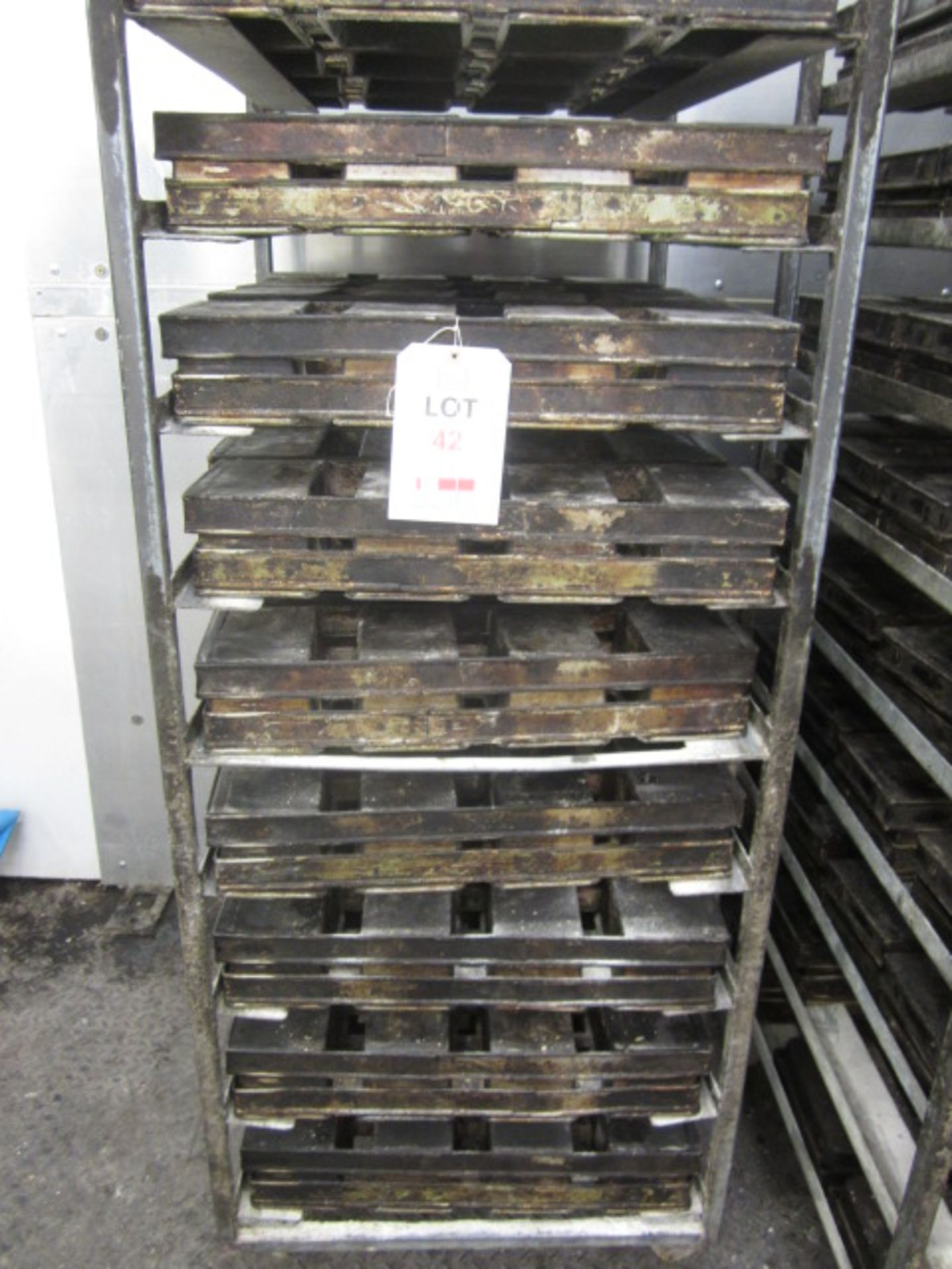 Thirty-six bakers bread tins, 4 per tin (Excludes trolleys)