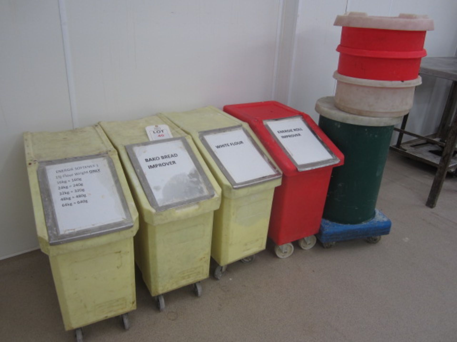Four plastic mobile ingredients bins and additional mobile dolly trolley with ingredients bin