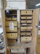 Timber cupboard with contents of assorted cutters, drill bits, etc.